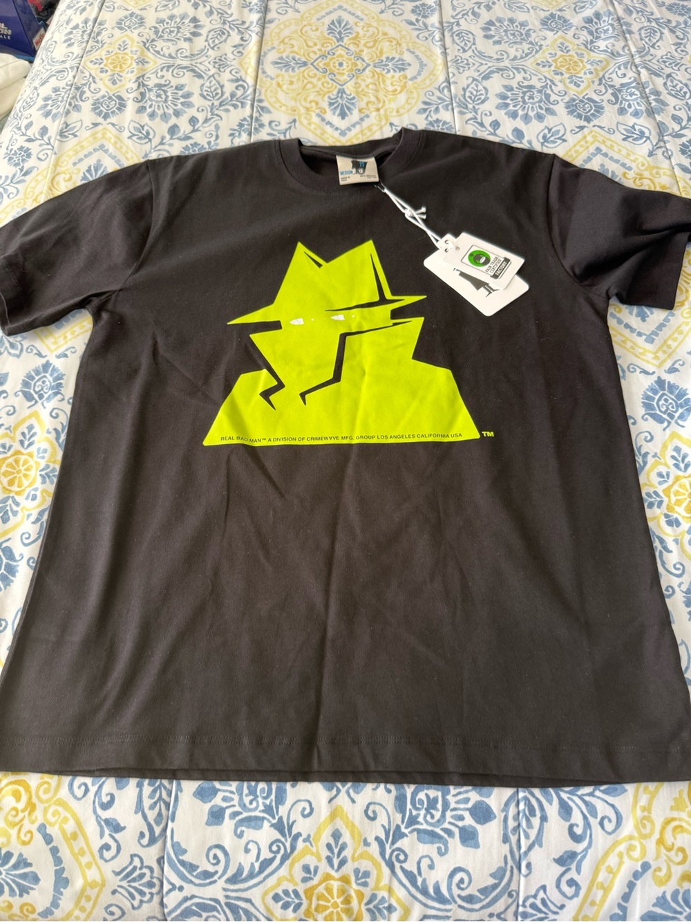 Real Bad Man Men’s Black Short-Sleeve Tee with Neon Lime Spy Graphic
